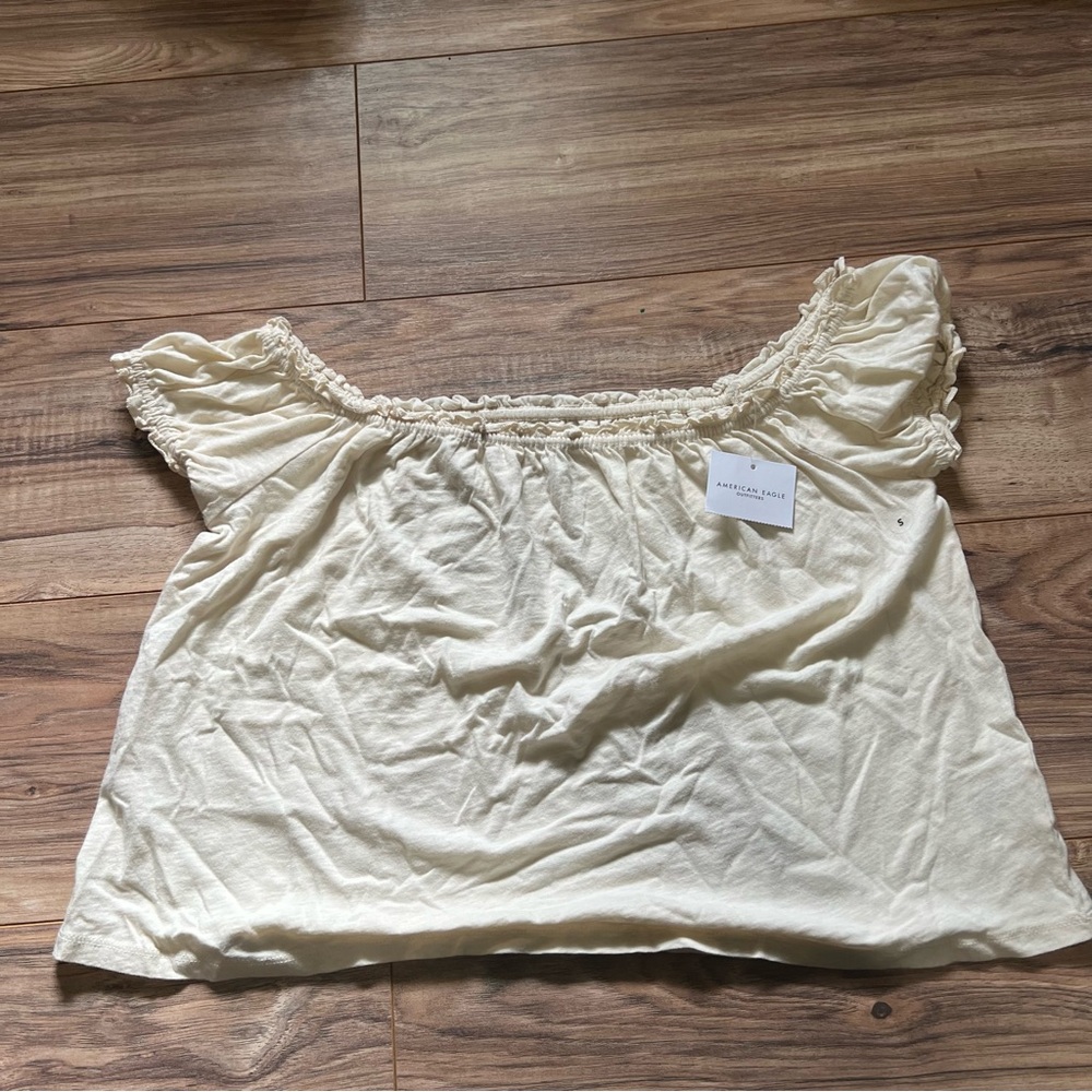 American Eagle Outfitters Cream Ruffle off the shoulder shirt